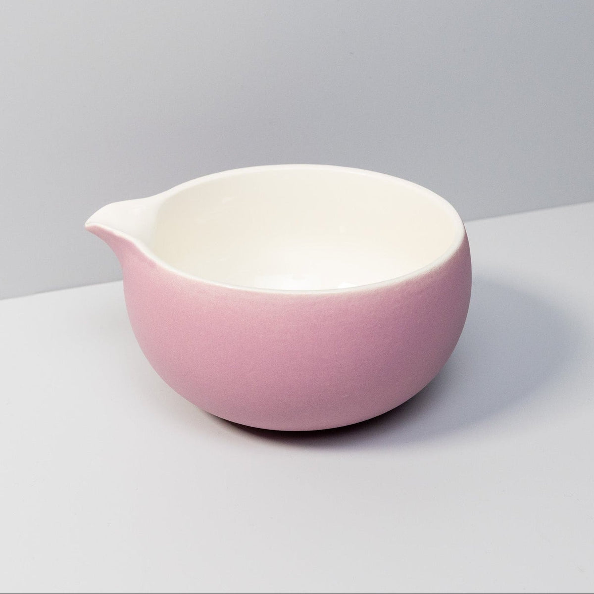 Handcrafted rose ceramic matcha bowl with a pouring spout.