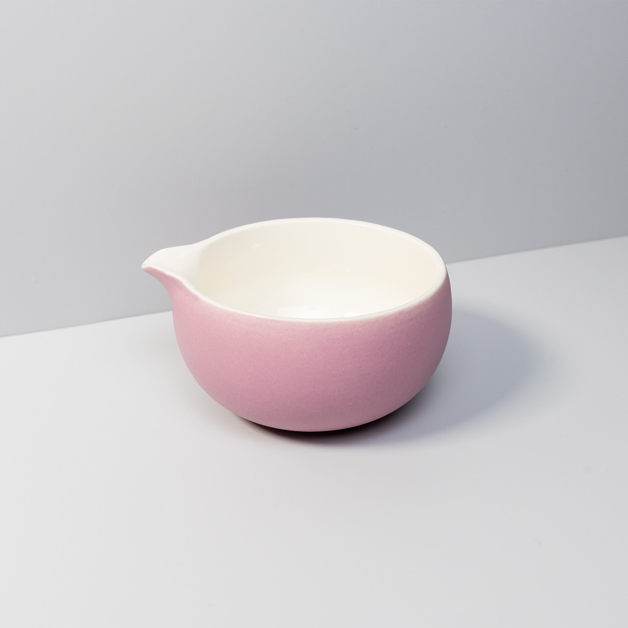 Handcrafted rose ceramic matcha bowl with a pouring spout.